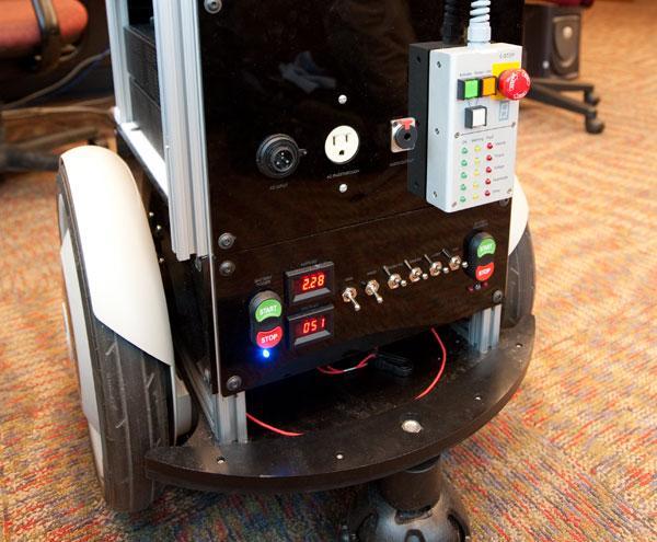 picture of the back of a mobile robot showing power meters and switches
