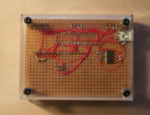 photo of the back side of the board showing the hand wiring with red 30-gauge wire