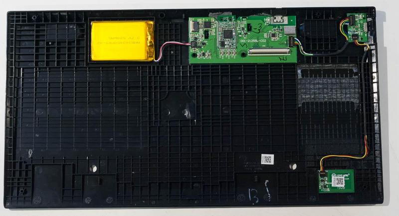 the bottom half of the case of the opened keyboard shwing the battery,
    main board, and NFC pairing board