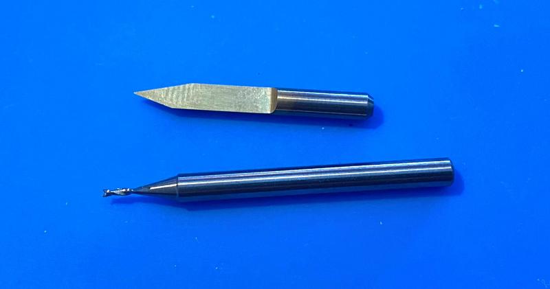 30˚ v-bit engraving tool for traces, 0.8mm 2-flute endmill for
    holes and routing the board outline.